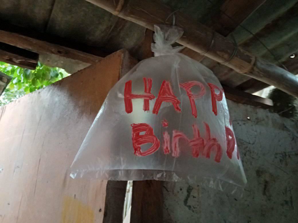 kids who couldn't afford balloons blow up plastic bags for dad's birthday 