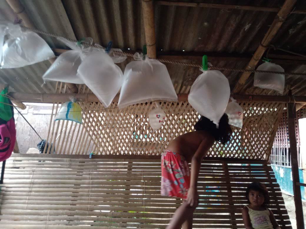 kids who couldn't afford balloons blow up plastic bags for dad's birthday 