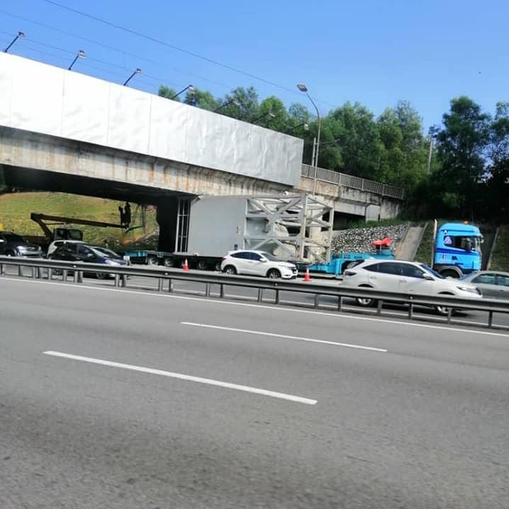 lorry stuck under flyover causes massive jam on the nkve