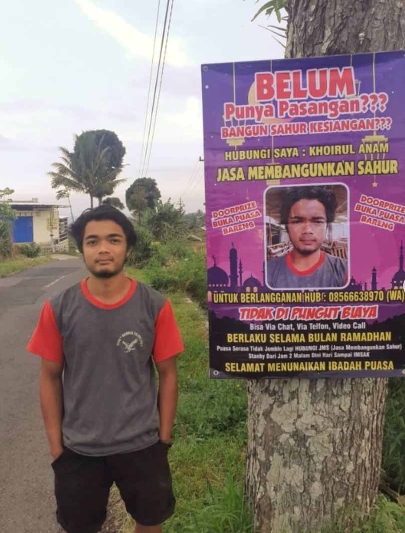 indonesian man offers service to wake you up in time for sahur during ramadan month