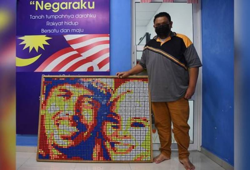 malaysian goes viral for creating beautiful portraits using only rubik's cube