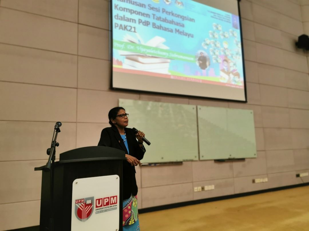 Linguistics professor speaking conference Malay language