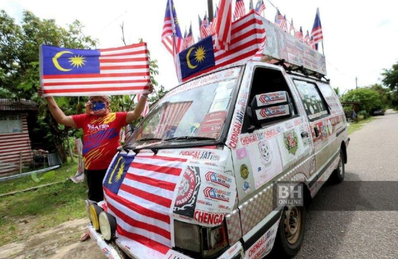 army veteran collects and decorates his home with old jalur gemilang flags to show his patriotism th