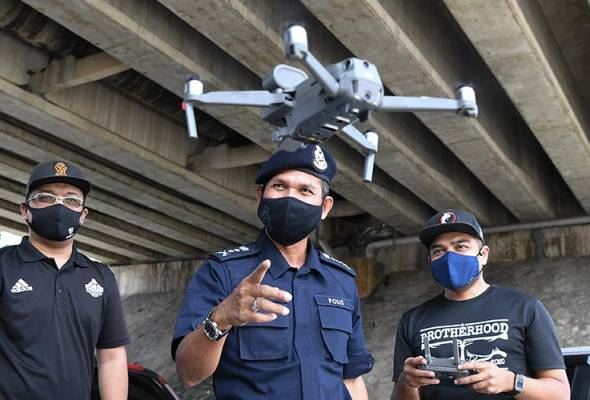 polis terengganu guna dron pantau suhu orang awam