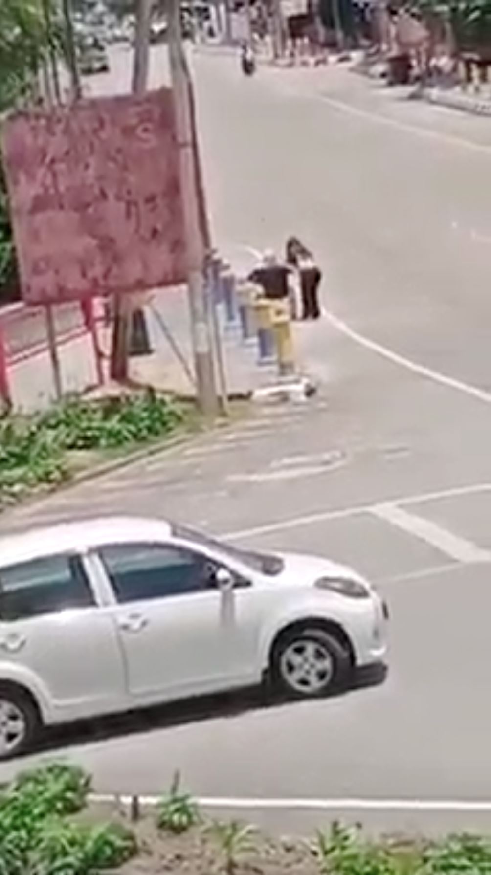 msian woman helps struggling elderly in wheelchair by giving her a ride