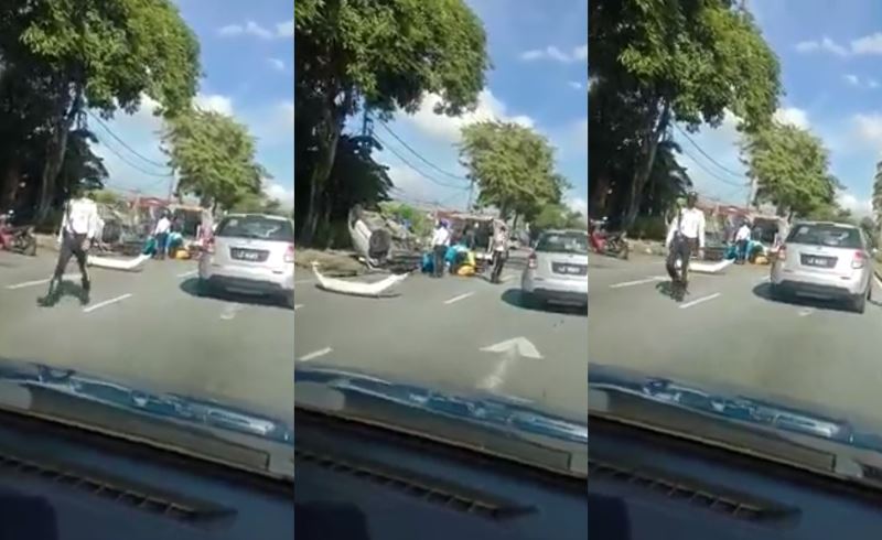 m’sian driver fined for using his phone to record an accident while driving