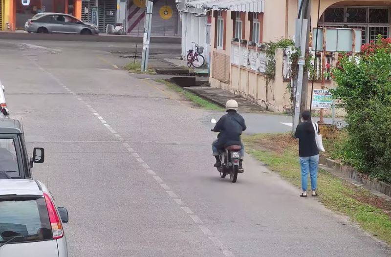 kelantan police are looking for a man caught on cctv harassing a young girl