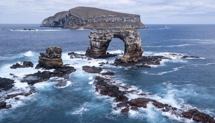 world famous galapagos rock formation, darwin’s arch collapses from erosion 