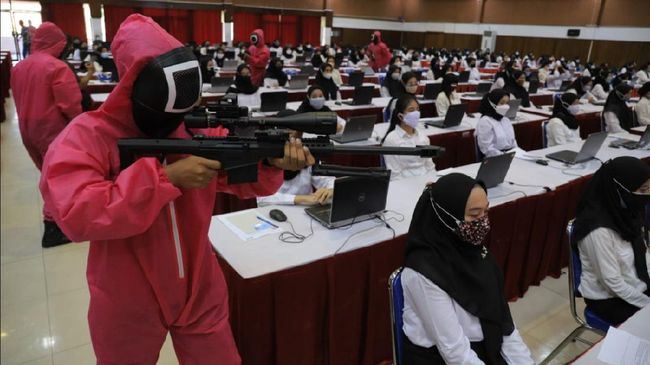 indonesian government hires squid game guards to make sure candidates don’t cheat in exam