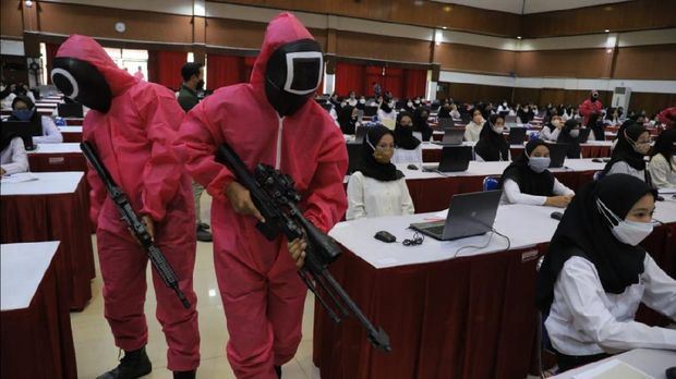 indonesian government hires squid game guards to make sure candidates don’t cheat in exam