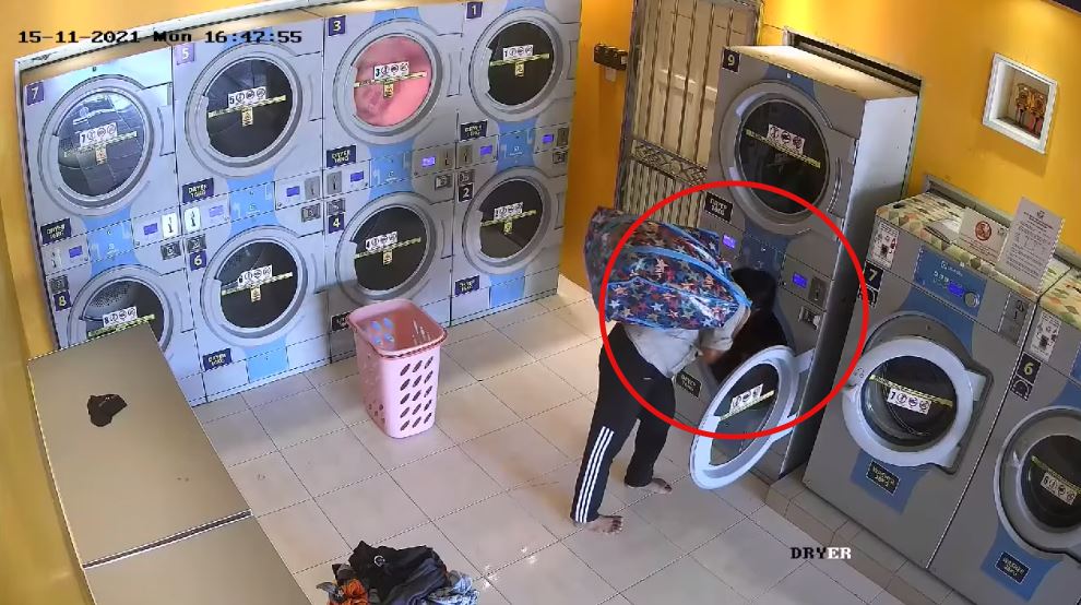 cctv footage caught couple stealing clothes from self service laundromat in kelantan