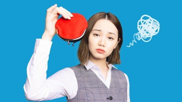 Young woman broke holding empty wallet payday