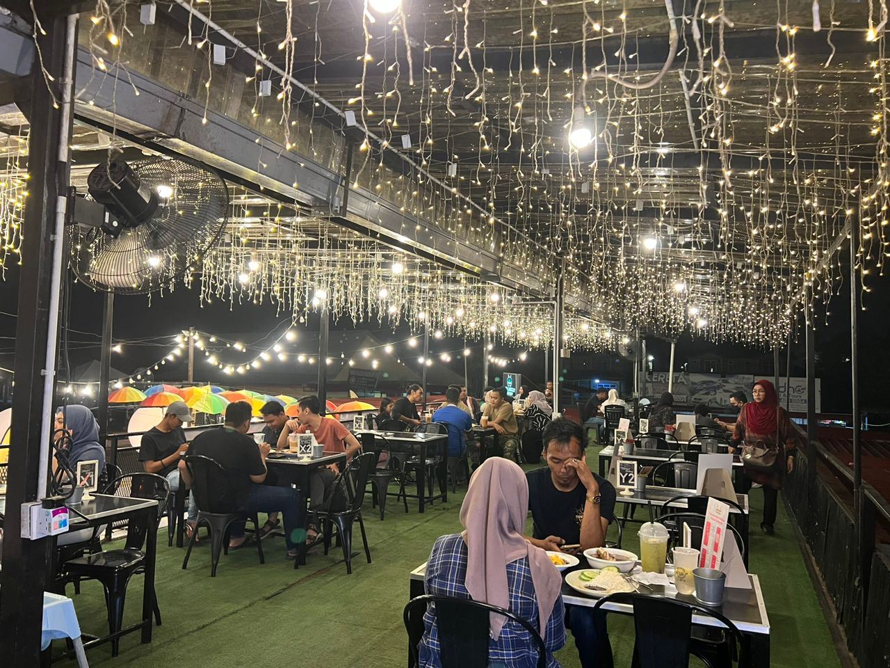 Atmosphere at a restaurant in Kedah during DuitNow Football Fever Party