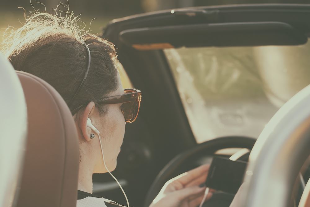 Woman listening music while driving