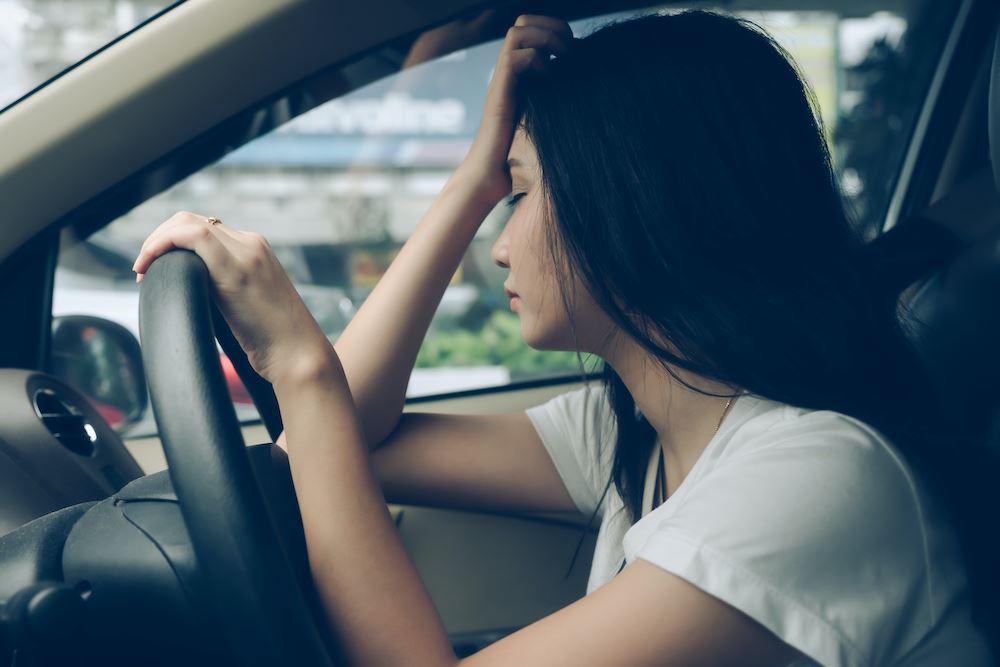 Woman stressed while driving