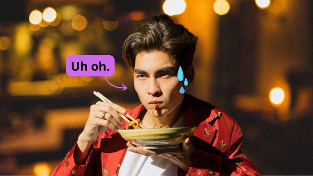 Asian man sweating while eating spicy noodles