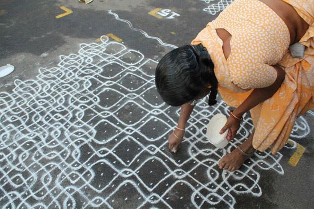 Traditional Deepavali kolam uses white flour