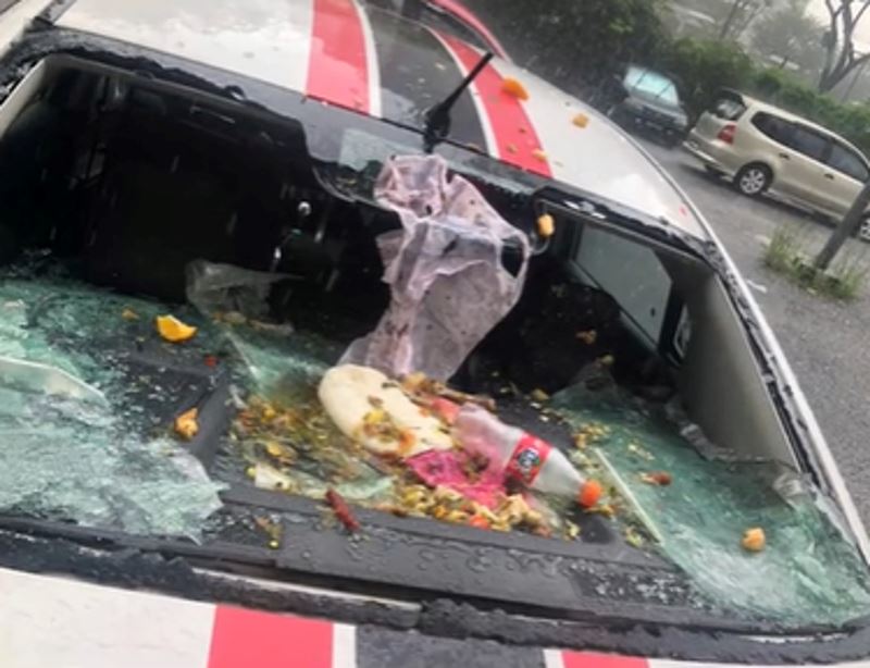 m’sian woman horrified to see car trashed and windscreen smashed after neighbor throws rubbish from top floor
