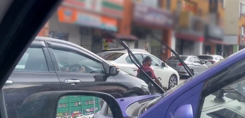 disabled man forced to navigate on busy road as motorcycles parked on wheelchair-friendly sidewalk