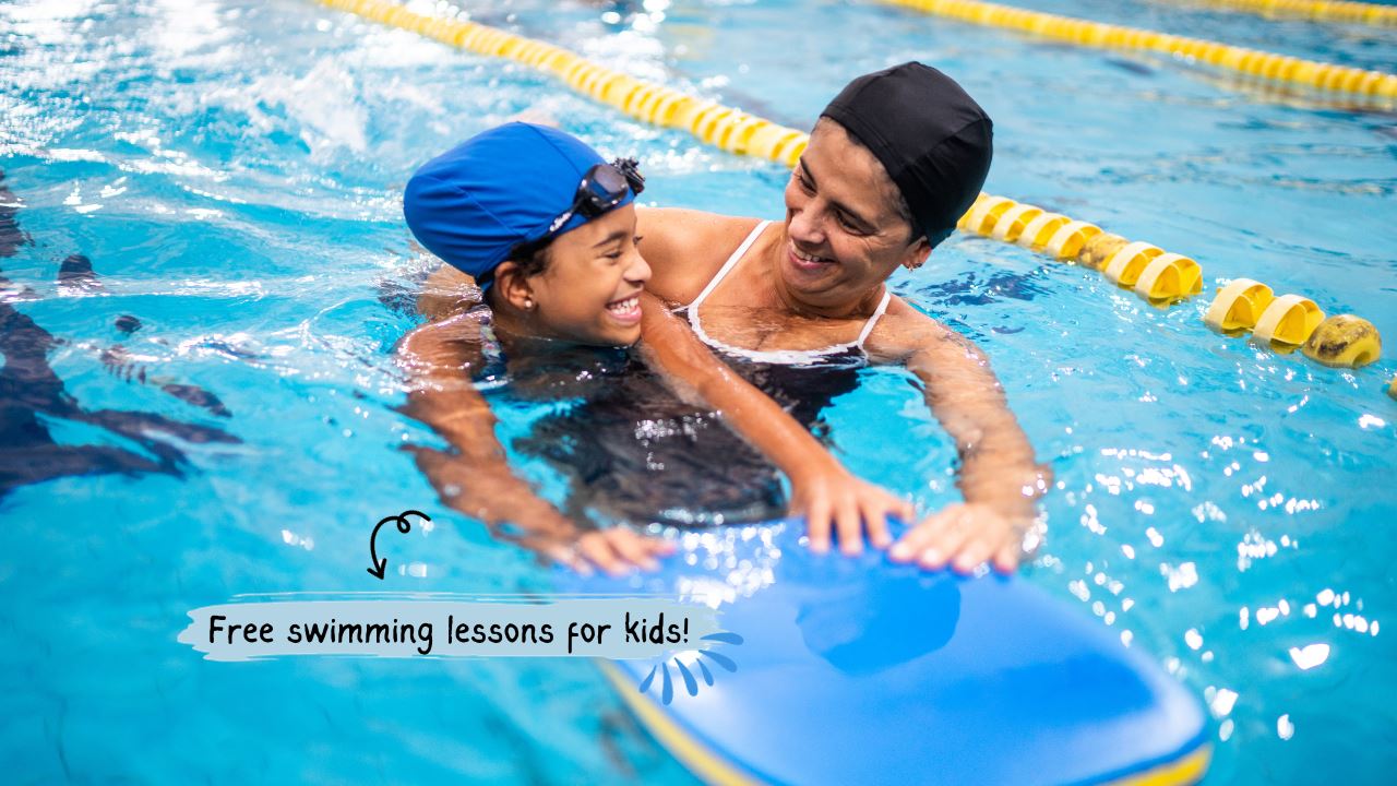 Woman teaching child how to swim in a pool
