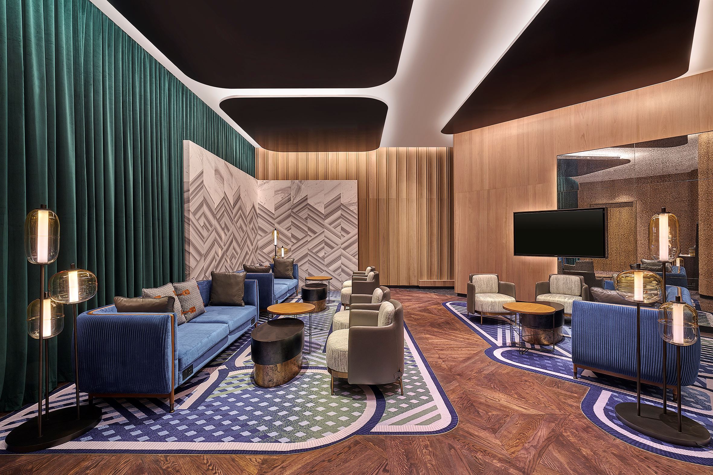 a warmly lit gathering room at Renaissance KL