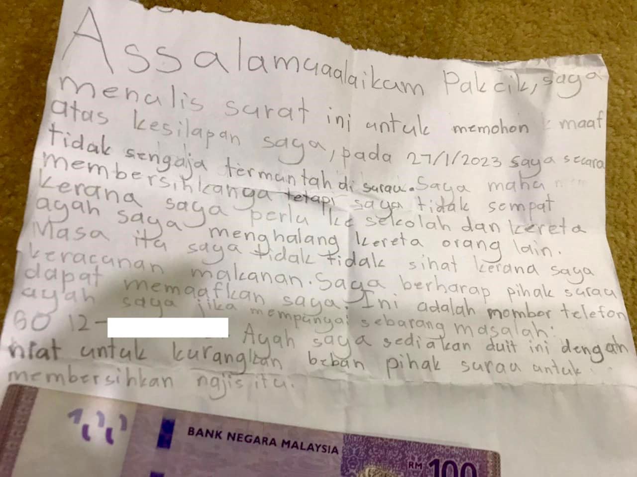 young boy leaves letter & rm100 note apologising for accidentally throwing up in surau