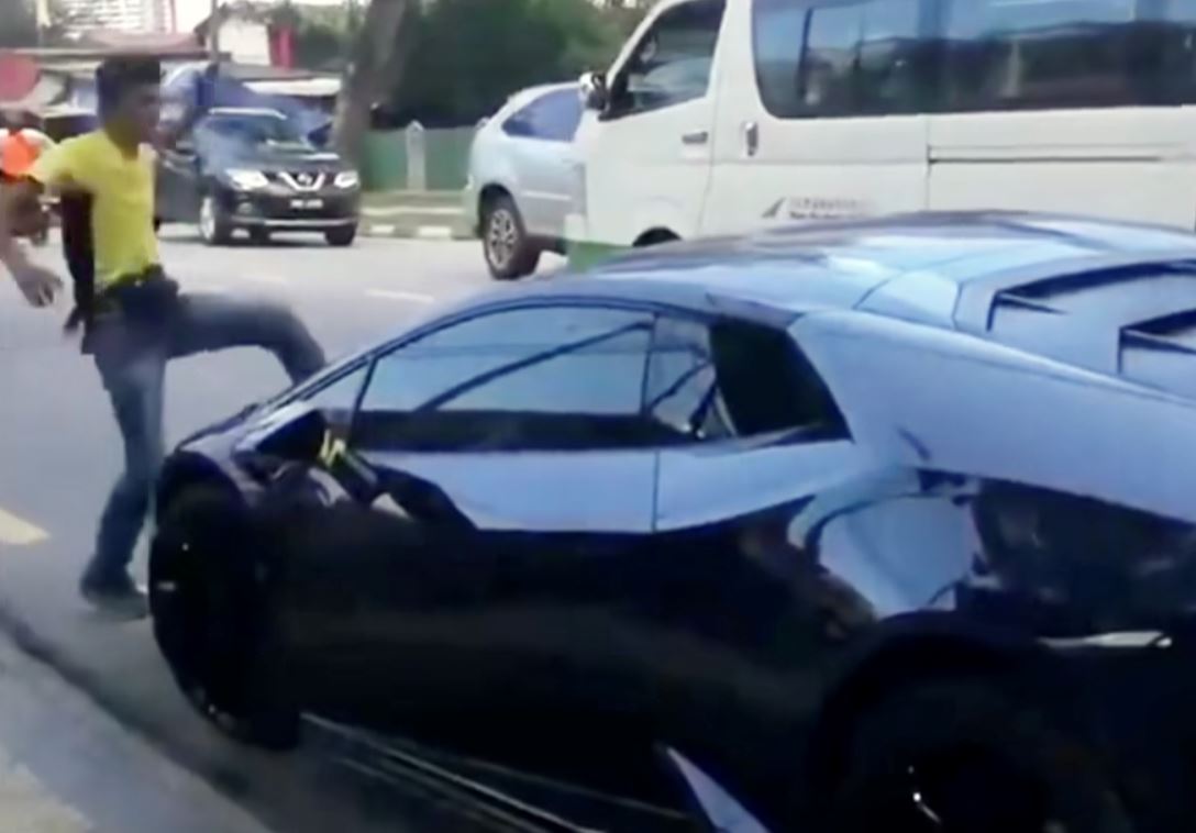 luxury car damaged by man in penang for illegal parking and blocking pwd pathway