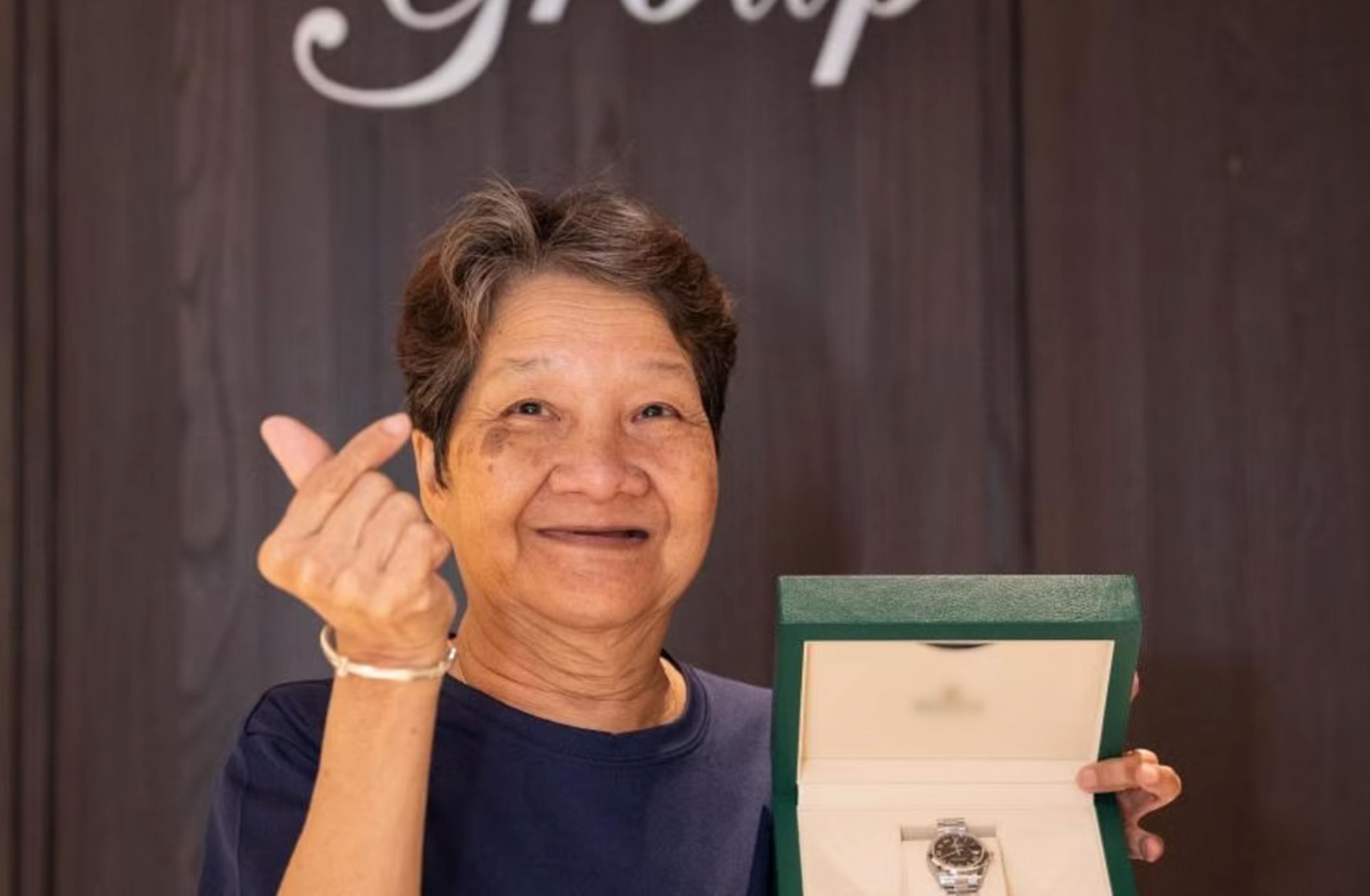cleaner aunty in singapore surprised with luxury watch worth rm34,400 at company’s annual dinner