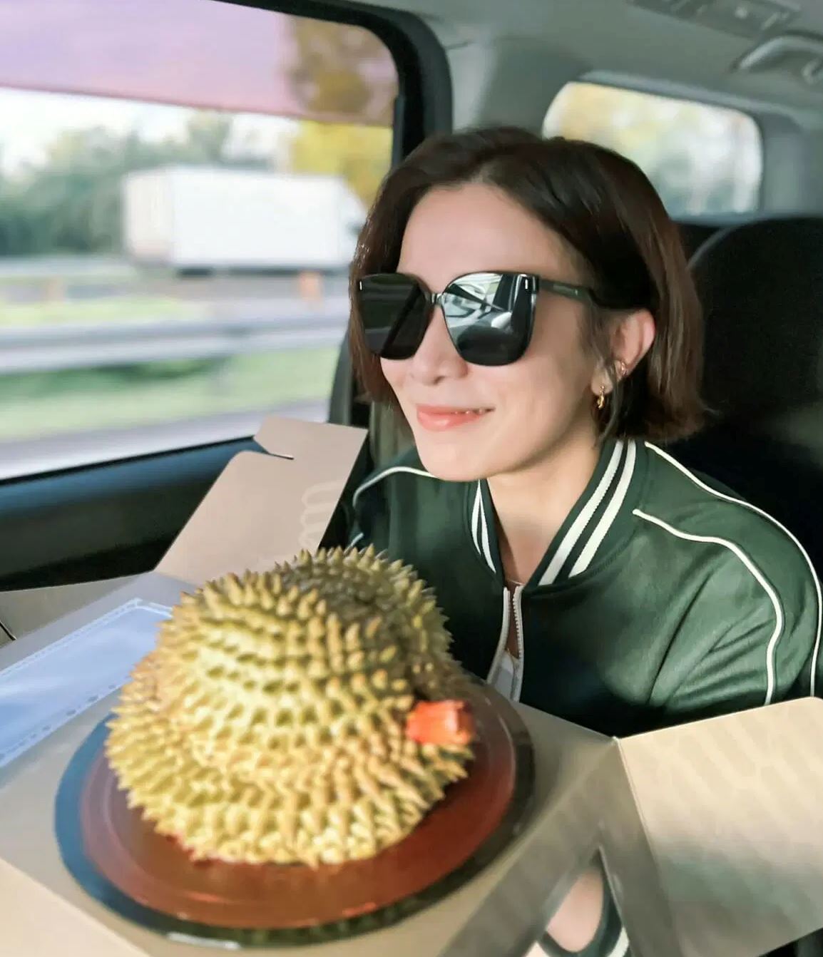 hong kong actress, charmaine sheh excited by durian cake gift from fan as she arrives in malaysia