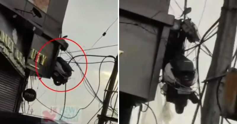 netizen tertanya-tanya macam mana motor skuter ini boleh tergantung atas kabel elektrik?