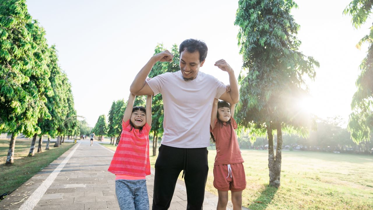happy family jogging in park