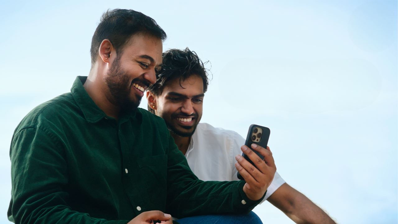 Suresh and his friend Manoj sharing a laugh during a video call