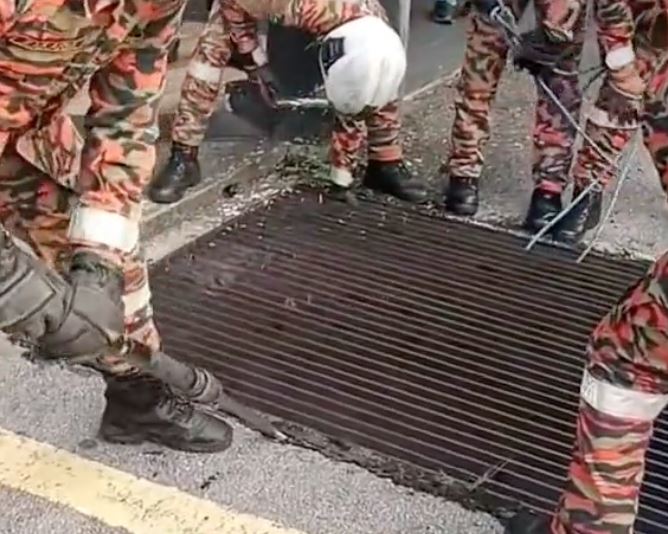 heroic abang bomba saves elderly homeless man trapped in 2-meter deep drain