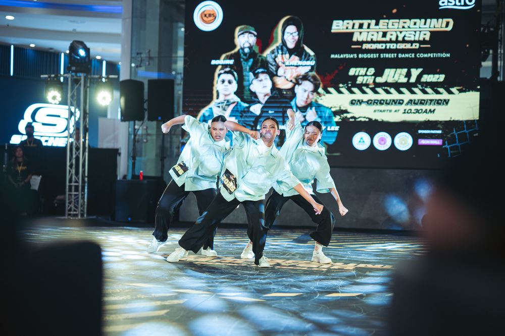 Group of 3 Malaysian women dancing at Battleground Malaysia