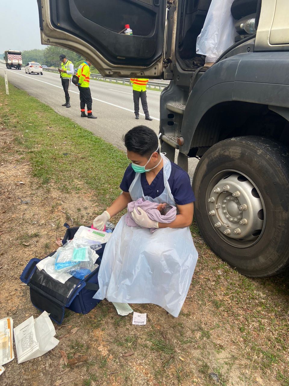 medical team assists woman who unexpectedly gives birth in a truck on the highway