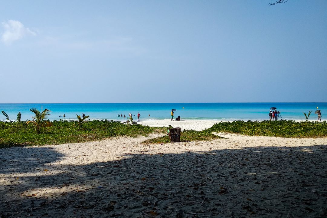 People enjoying a sunny day at Radhanagar beach at Havelock Island