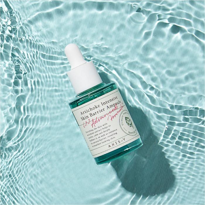 A serum bottle floating in water