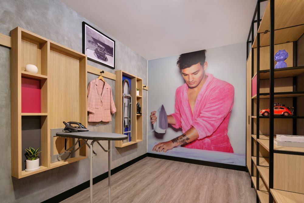 Ironing room with stylish backdrop of a man