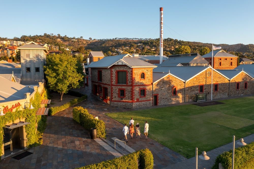 Buildings with trees and a group of people walking