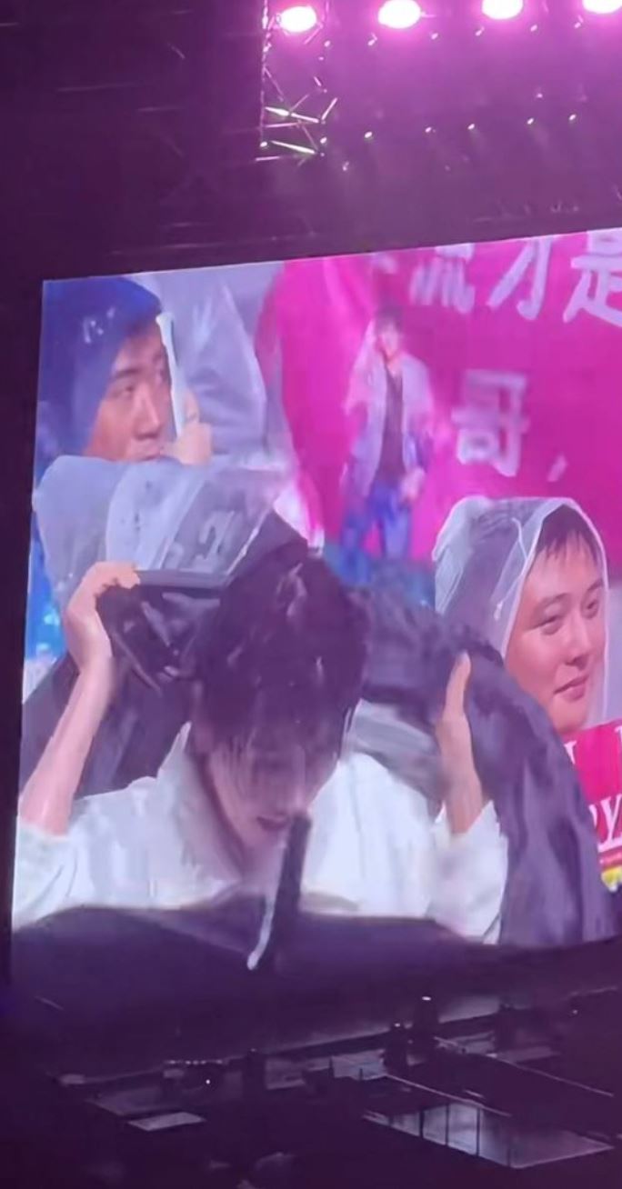 so lucky! jay chou gives fan his s$19,000 jacket to shield from rain during concert
