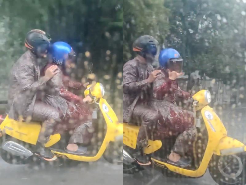 newlyweds capture hearts riding a motorbike in the rain while still in their wedding attire!