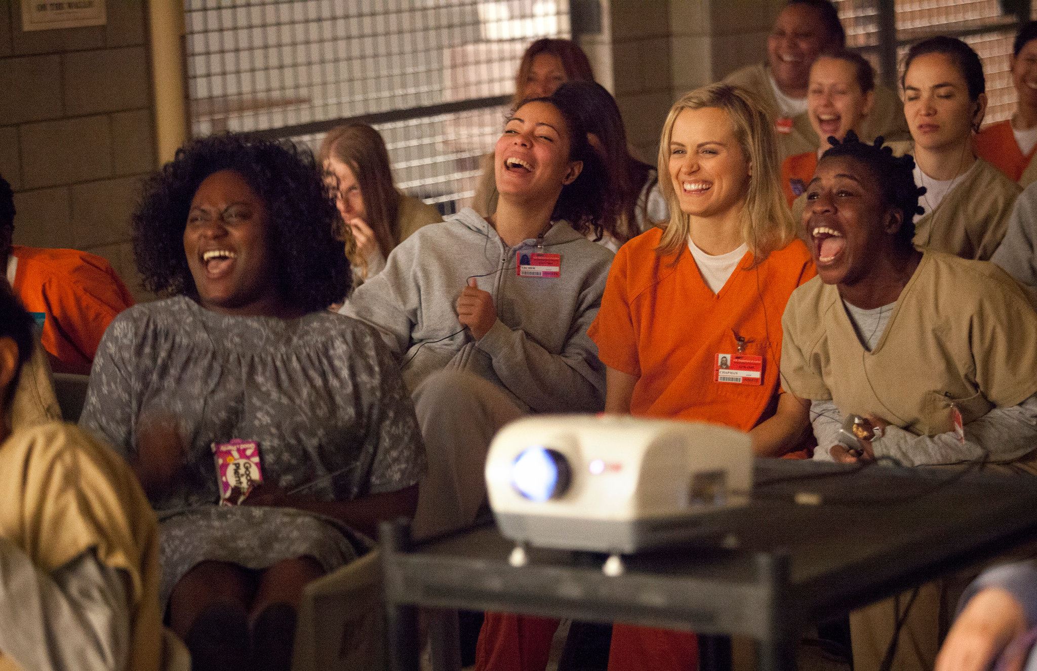 A group of women laughing in prison