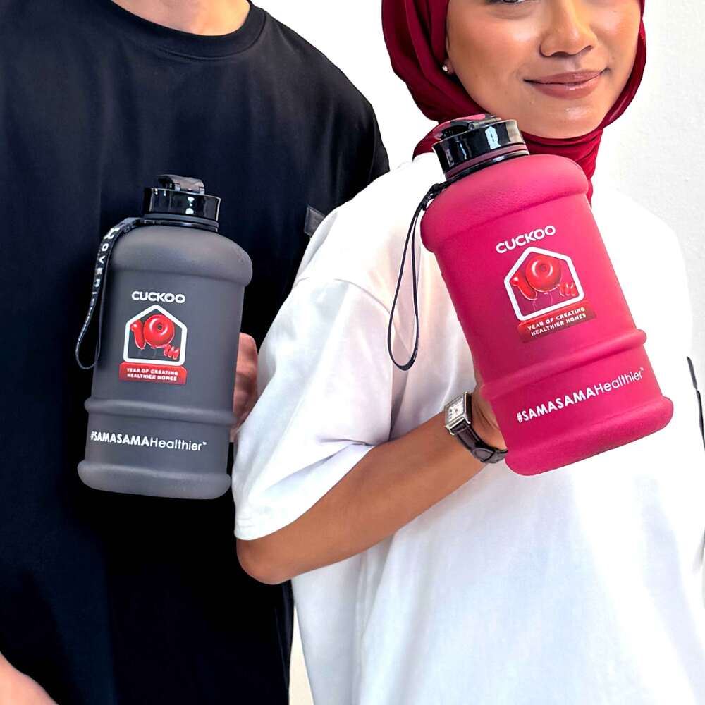 Two people posing with a brand’s merch