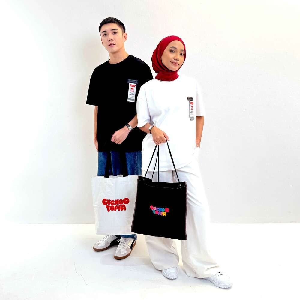 Two models posing with a brand’s merch