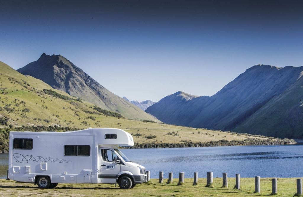 A campervan by the mountains and river