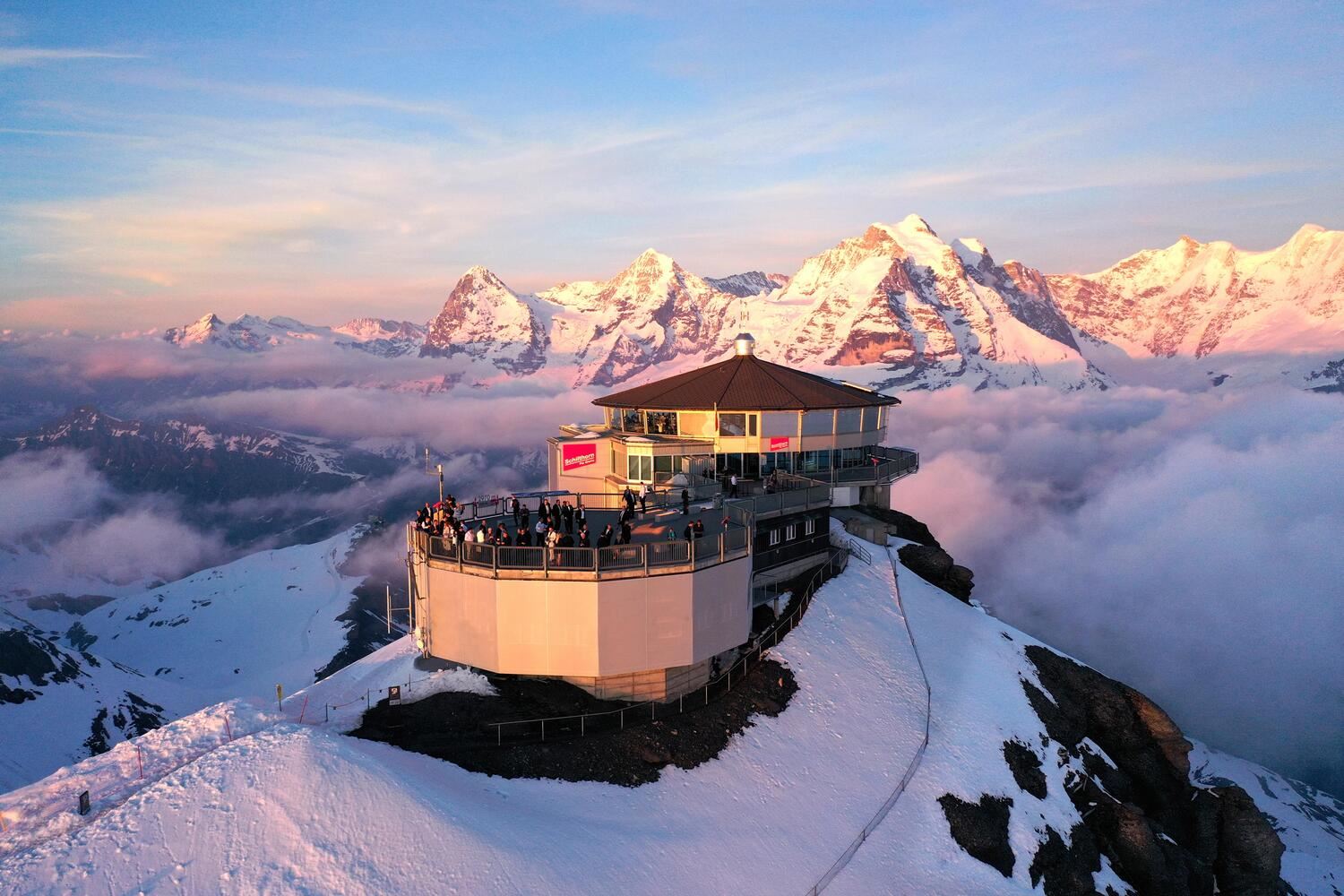 A restaurant on a mountain during sunset