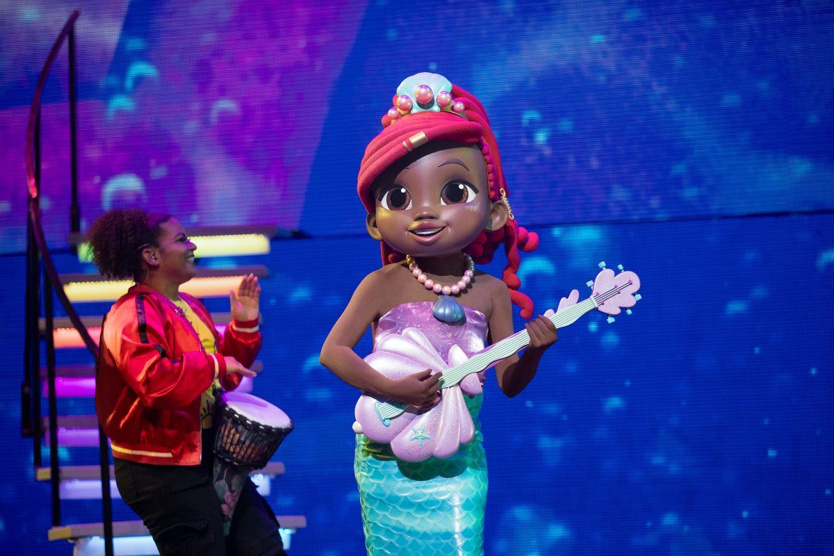 Ariel the Little Mermaid playing shell-shaped guitar