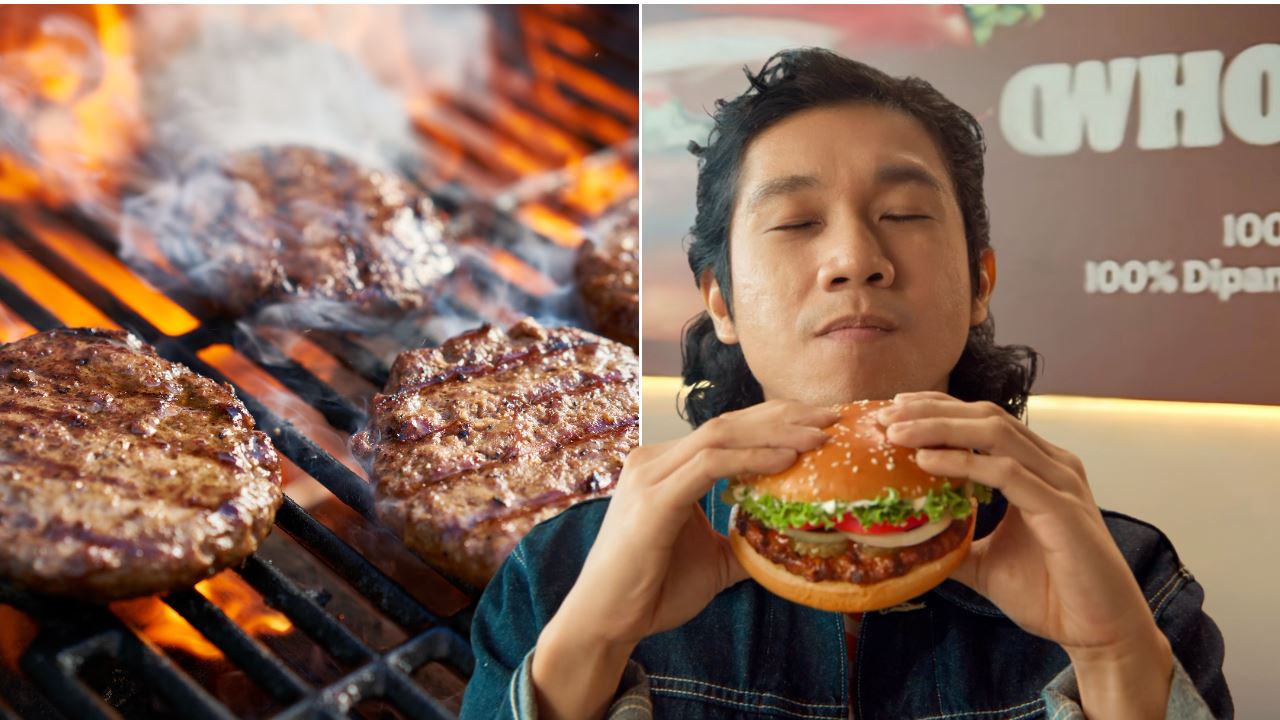 daging burger atas pemanggang dan lelaki makan burger