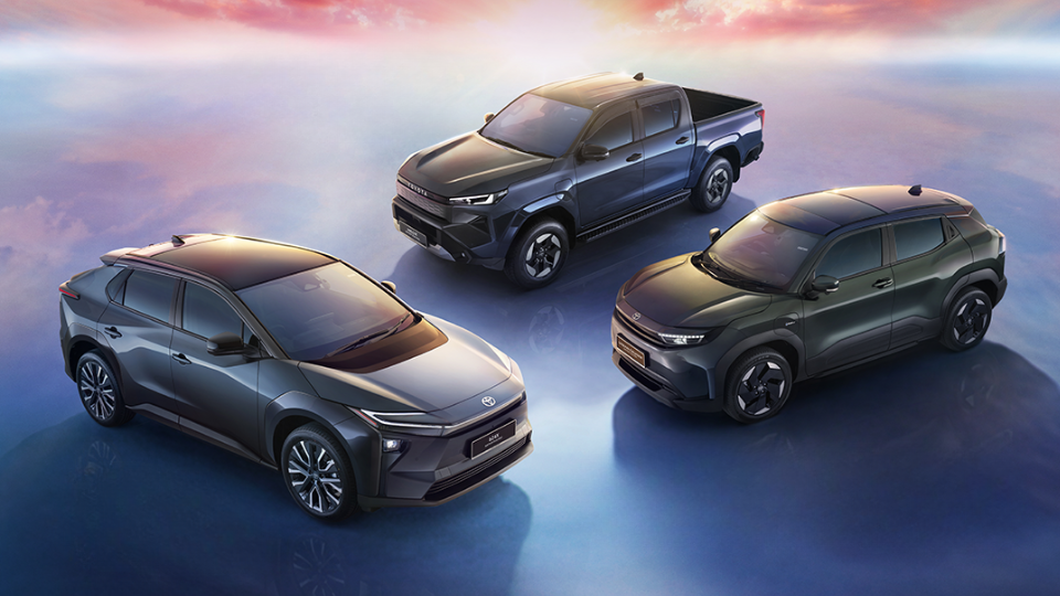 Three cars parked facing each other 