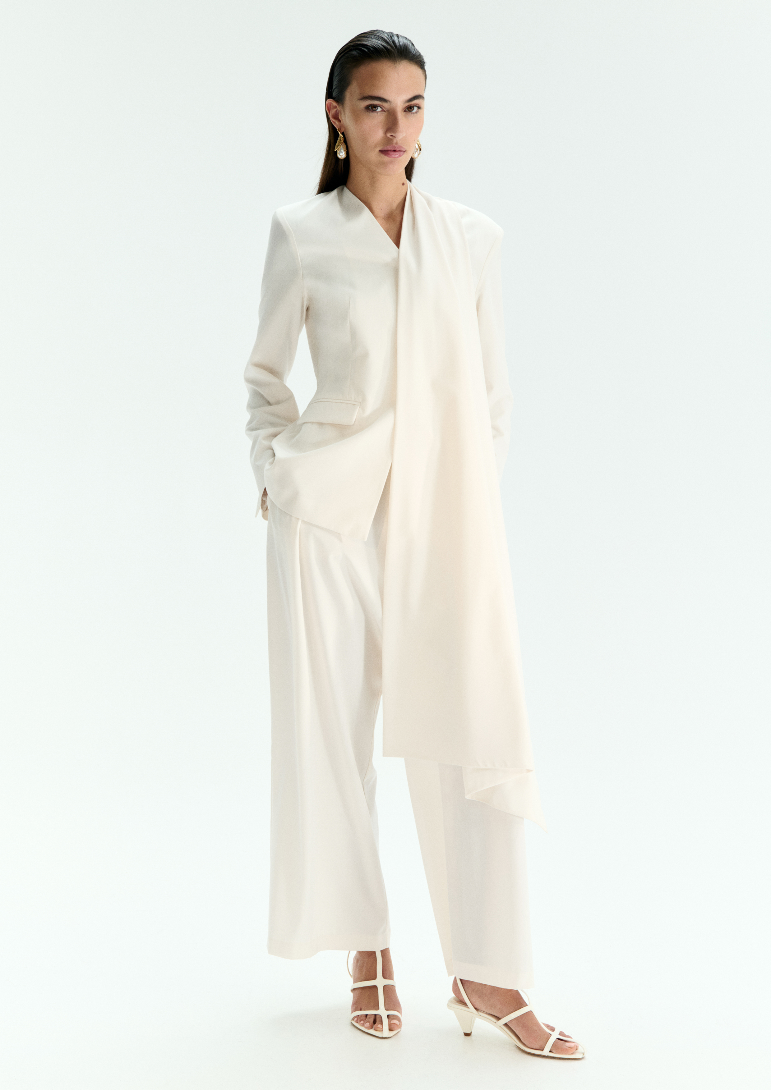 A model posing in a white set